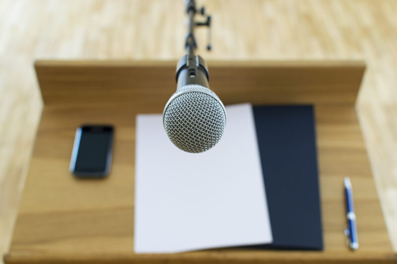 Would you like to know how to write a motivational speech? Read our quick guide to learn tips on how to write a speech that will captivate your audience.